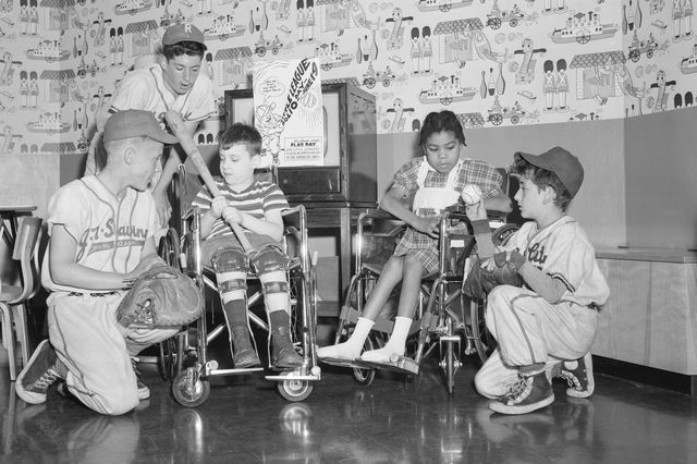 Members of the Three Queens' Little Leaguers visit polio patients at a New York City hospital on June 8, 1955.